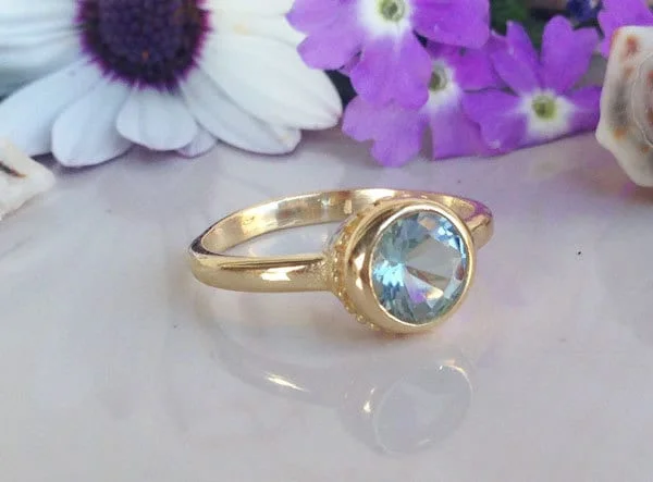 Opal Gemstone Rings with a Rainbow - Hued Play of ColorAquamarine Ring - March Birthstone - Simple Bezel-Set Ring with Round Aquamarine Gemstone