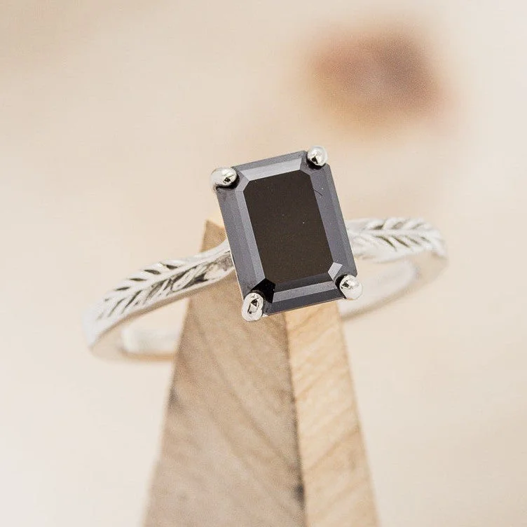 "HOPE" - EMERALD CUT MIDNIGHT BLACK MOISSANITE SOLITAIRE ENGAGEMENT RING WITH FEATHER ACCENTS