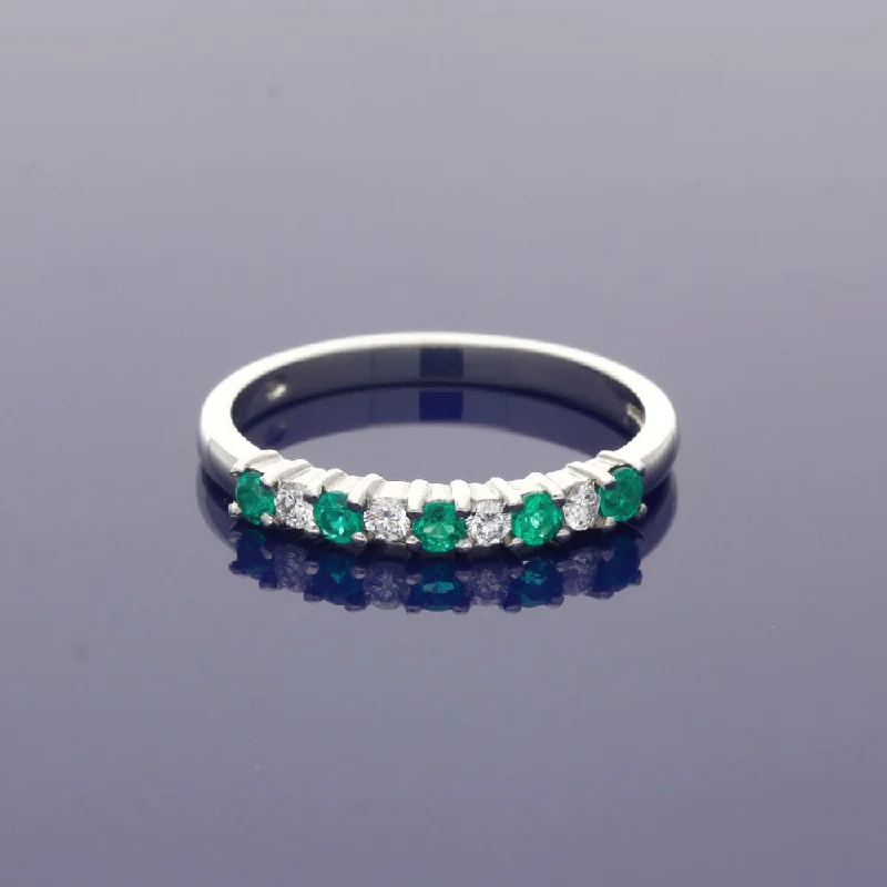 Emerald Gemstone Rings with Diamond - Encrusted HalosPlatinum Emerald & Diamond Half Eternity Ring