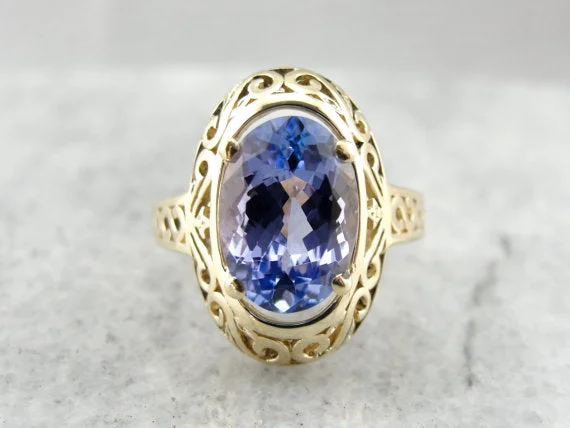 Opal Gemstone Rings with a Rainbow - Hued Play of ColorLarge Purple Tanzanite Filigree Cocktail Ring