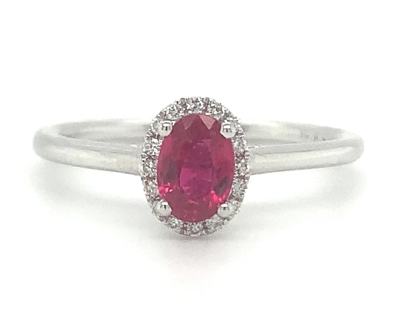 Topaz Gemstone Rings with a Faceted Cut and Shimmering Effect18ct White Gold Ruby And Diamond Halo Ring