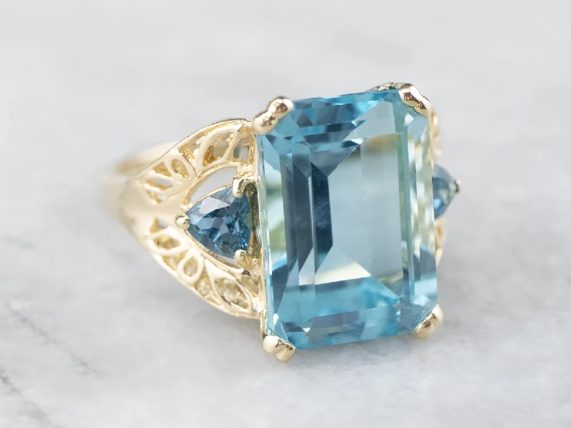 Emerald Gemstone Rings with Diamond - Encrusted HalosThree Stone Blue Topaz Gold Cocktail Ring